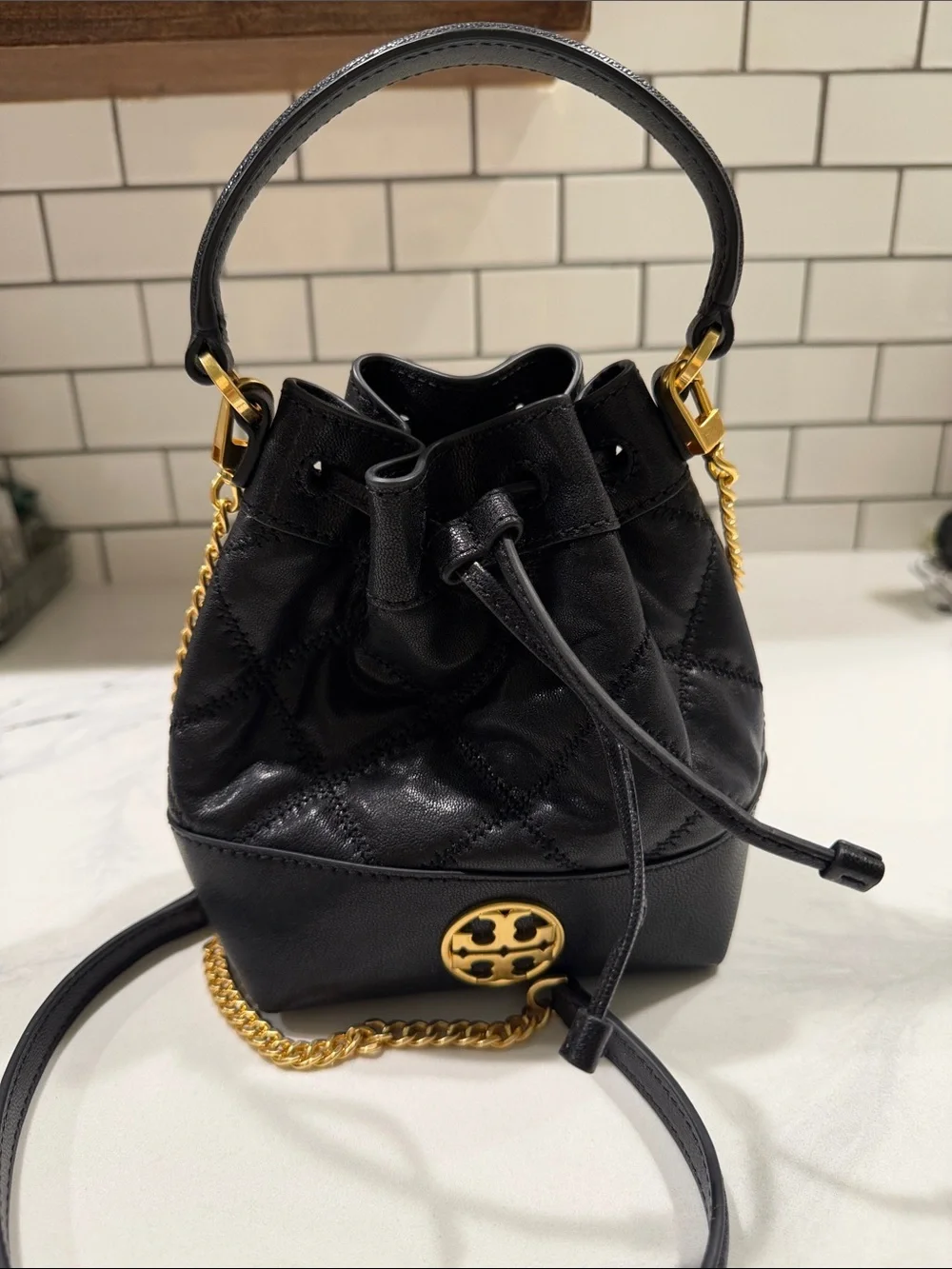 Tory Burch Black Leather Drawstring Mini Bucket Bag with Gold Logo